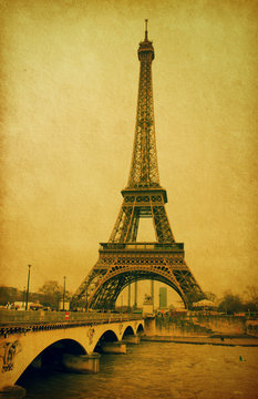 Eiffel tower view from Seine river. Photo in retro style.