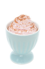dessert of whipped cream topped with grated chocolate isolated
