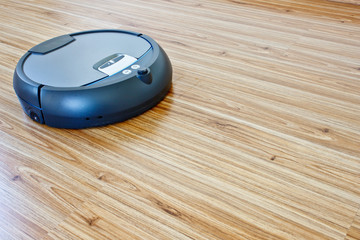 modern floor cleaning robot on laminate floor