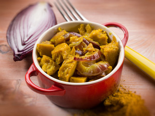 seitan stew with curry and onions, selective focus