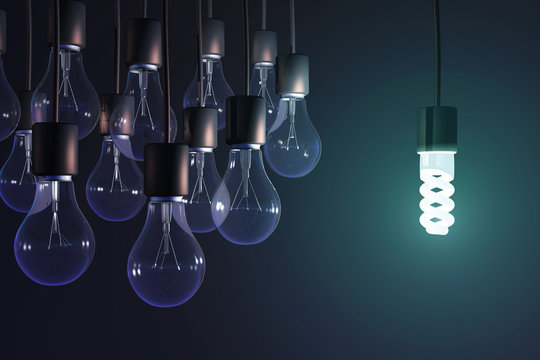 energy-saving lamp among the gray bulb