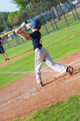 Pre-teen baseball player at bat