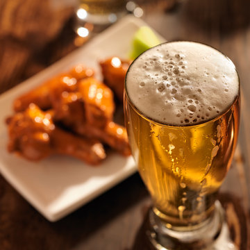 beer and chicken wings close up