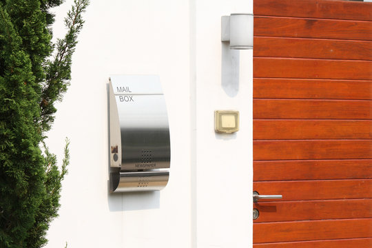 modern mail box in front of a house