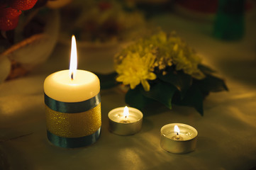 three small candle of light. Holiday romantic ambience and decor