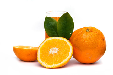 Glass of fresh orange juice and orange fruits