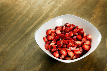 Sliced strawberries in a bowl