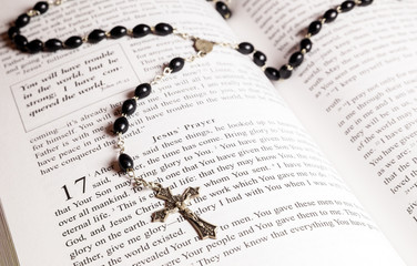 Rosary beads, cross and Bible
