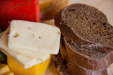 cheese and bread on a cutting board