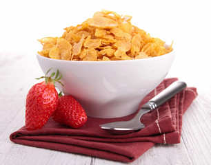 bowl of corn flakes with berries fruits