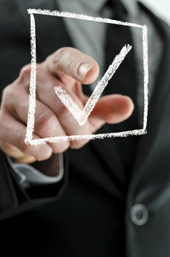 Business man making a checkmark