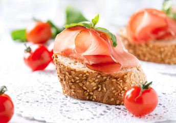 Jamon. Slices of Bread with Spanish Serrano Ham. Prosciutto