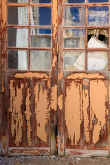 old door with textured paint falling apart