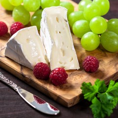 French cheese with raspberries and grapes