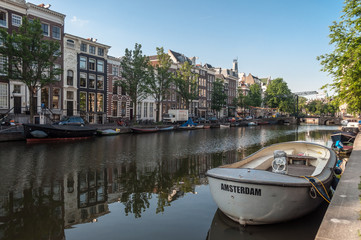 Anchored boats in one of the canals in Amsterdam, Netherlands