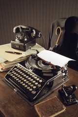 Old typewriter on a wooden desk