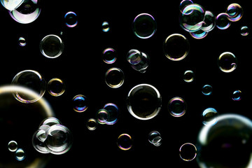 Colorful soap bubbles isolated on black background
