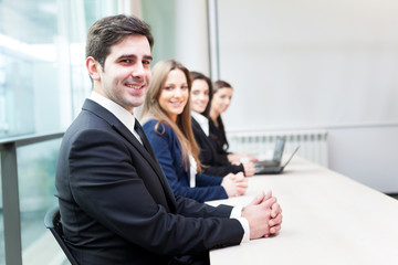 Group of business people smiling at the office lined up