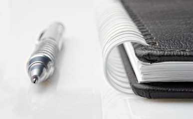 Close-up scratchpad with silver pencil