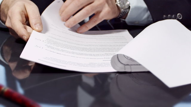 Close up of businessman signing a contract