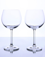 Empty wine glasses arranged and isolated on white