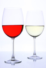 Red and white wine glasses isolated on white