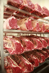 Cuts of beef on shelves in an abattoir