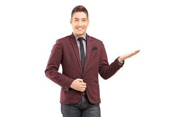 A stylish smiling male gesturing with his hand