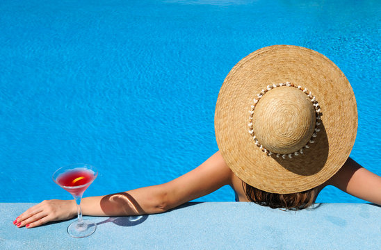 Woman At Poolside With Cosmopolitan Cocktail