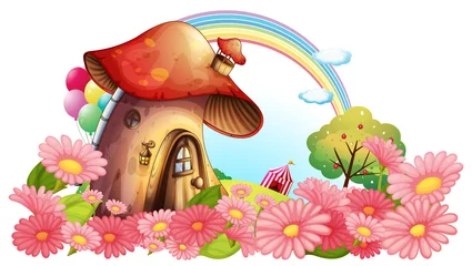 Fotobehang Sprookjeswereld Een paddenstoelenhuis met een bloementuin