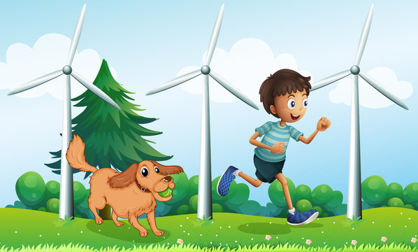 A boy and his dog near the three windmills