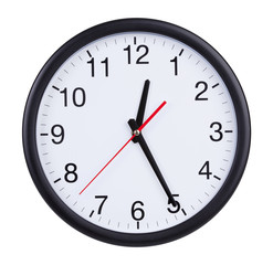 Office clock shows half of the first