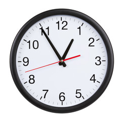 Office clock shows five minutes to an hour