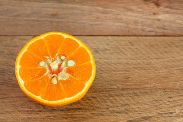 half orange on wooden table