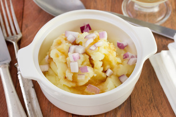 mashed potato with sauce and red onion