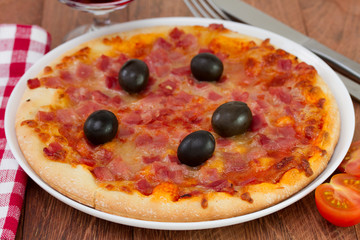 pizza with tomato and glass of wine