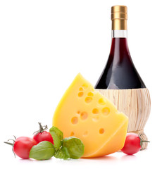 Red wine bottle, cheese and tomato still life