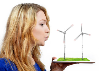 girl blowing on the wind turbines