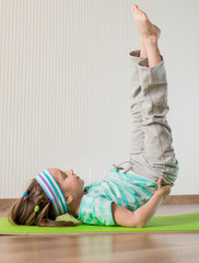 little girl doing gymnastic exercises