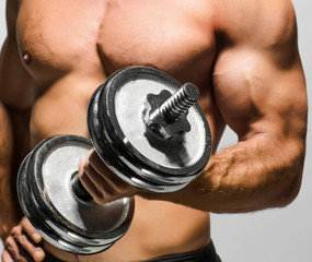 man working out with dumbbells