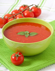 Traditional hot fresh diet tomato soup with basil