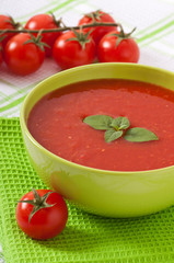Traditional hot fresh diet tomato soup with basil
