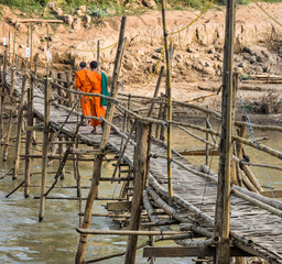 Monks on a wooden Bridge - Luang Prabang, Laos