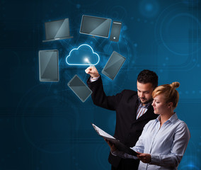 Happy couple touching cloud service