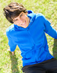 Fototapeta premium Young Man Sitting In Park
