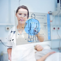 Nurse touching screen displaying blue human form