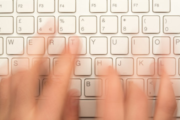 Hand typing on keyboard