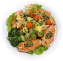 Salmon served with vegetables and greens