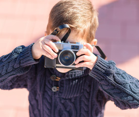 Little Boy Capturing Photo With Camera
