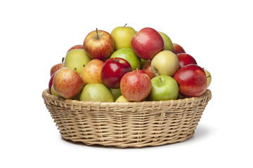 Fototapeta na wymiar Basket with different types of apples